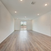Great room in Whitney plan at 4422 Chandler Road, building #31 at Covington in San Antonio by Century Communities