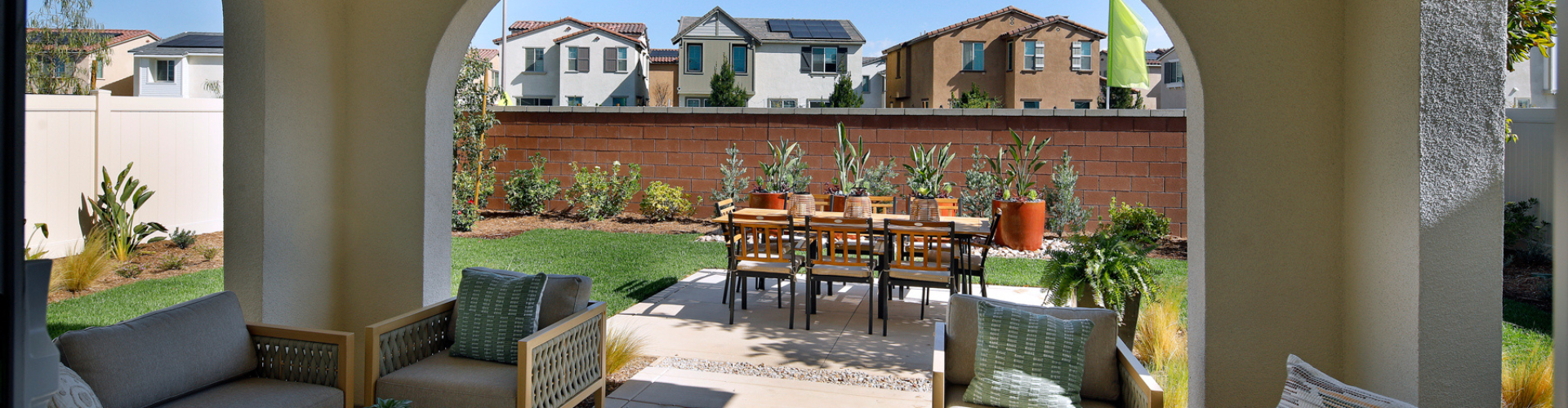 A patio with a table and chairs.