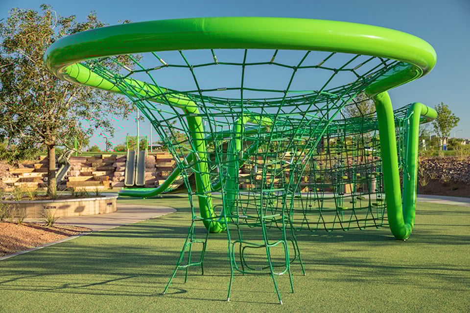 A green and blue playground slide.