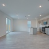 Open-concept living in Emory plan at 4422 Chandler Road, building #33 at Covington in San Antonio by Century Communities