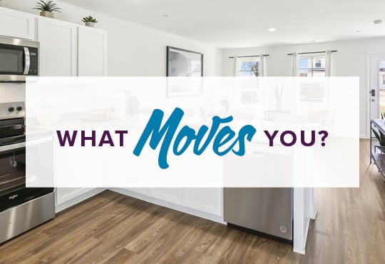 A kitchen with a white banner.