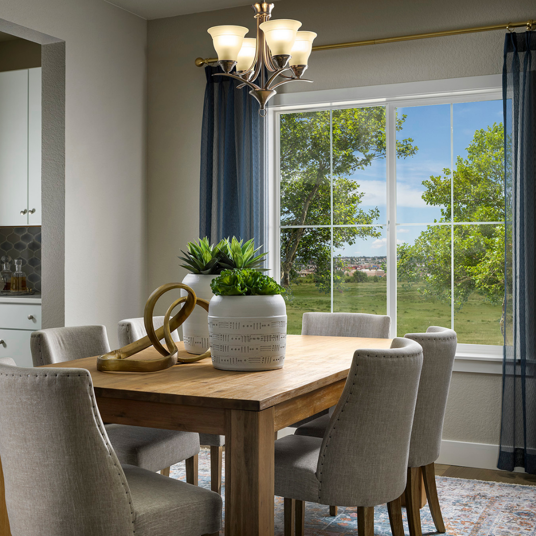 Casual dining area overlooking a large window. 