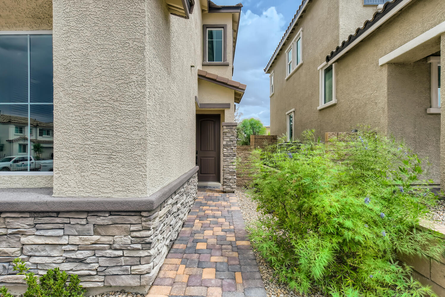 A brick path between buildings.