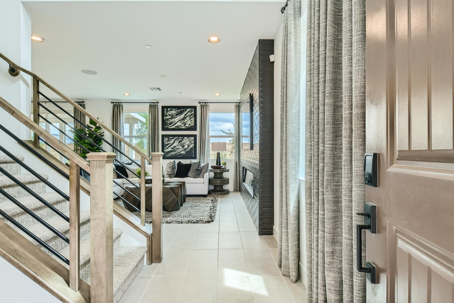 A room with a staircase and a window.