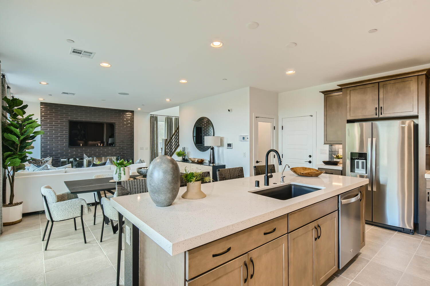 A kitchen with a marble island.