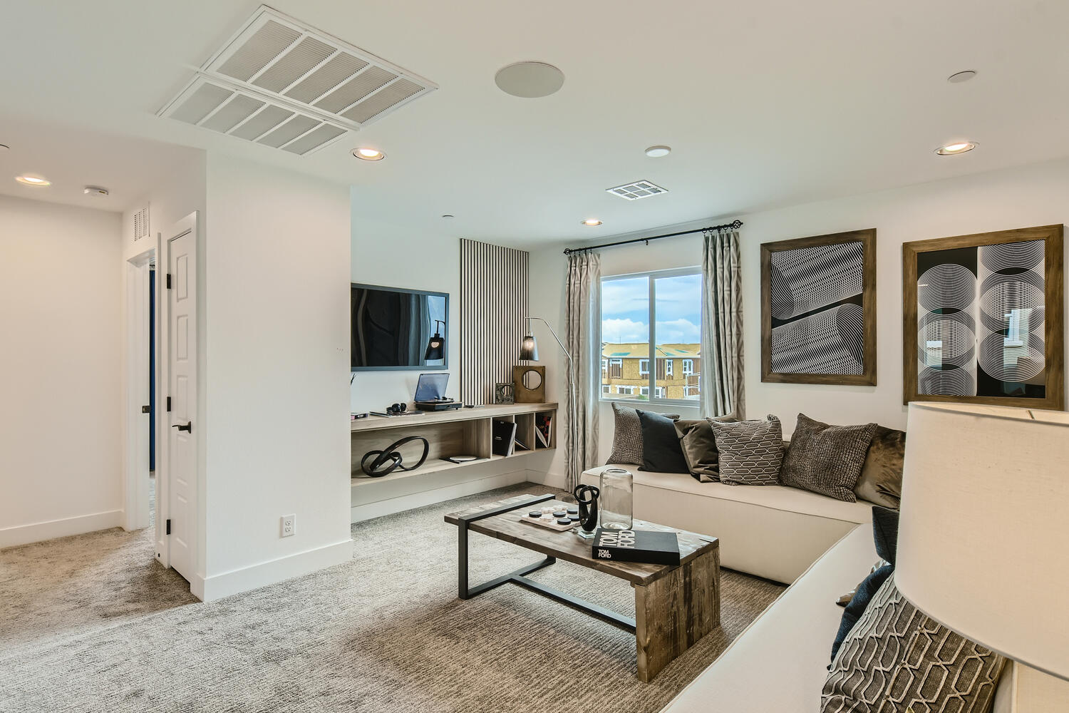 A living room with a tv and couches.