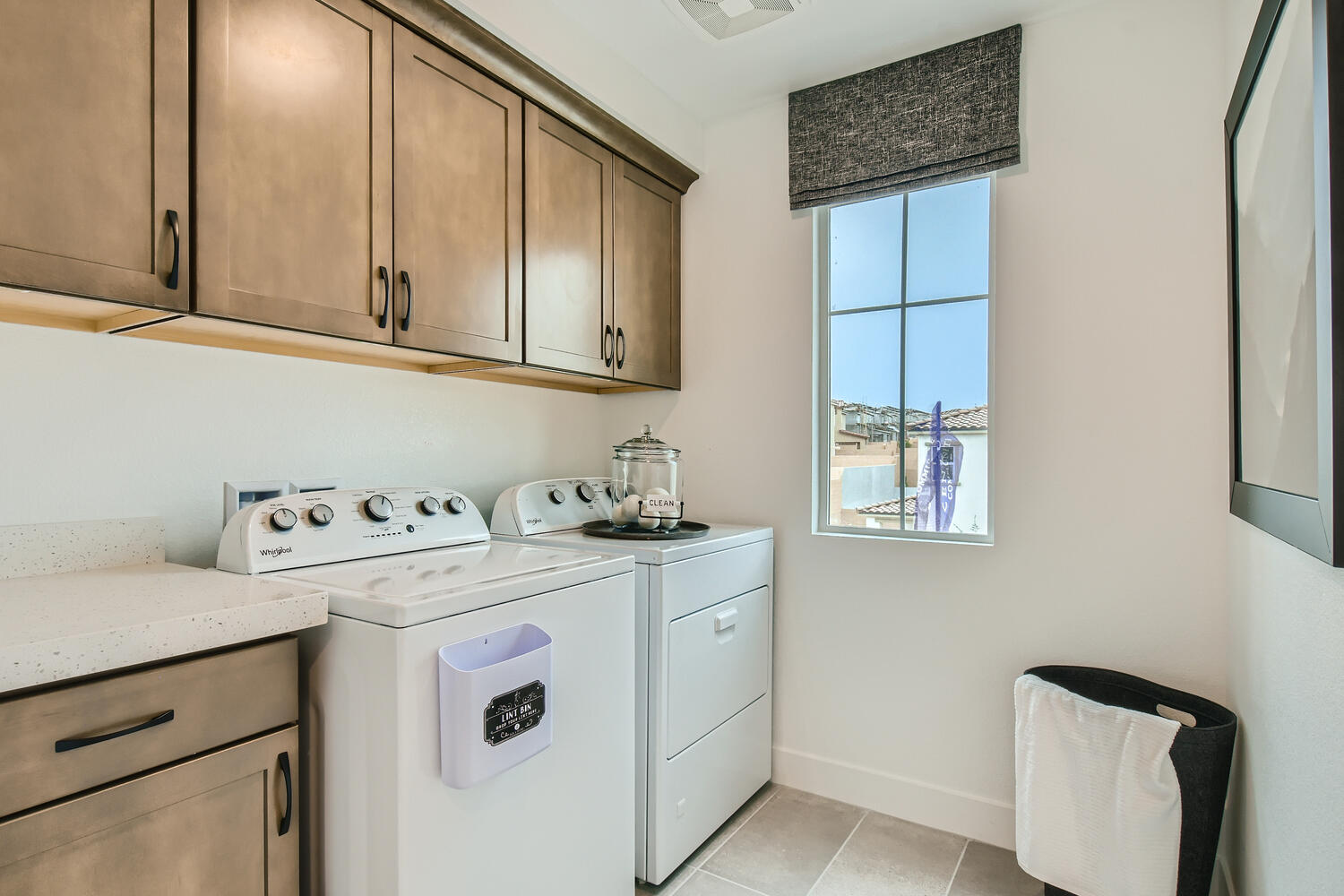 A kitchen with wooden cabinets.