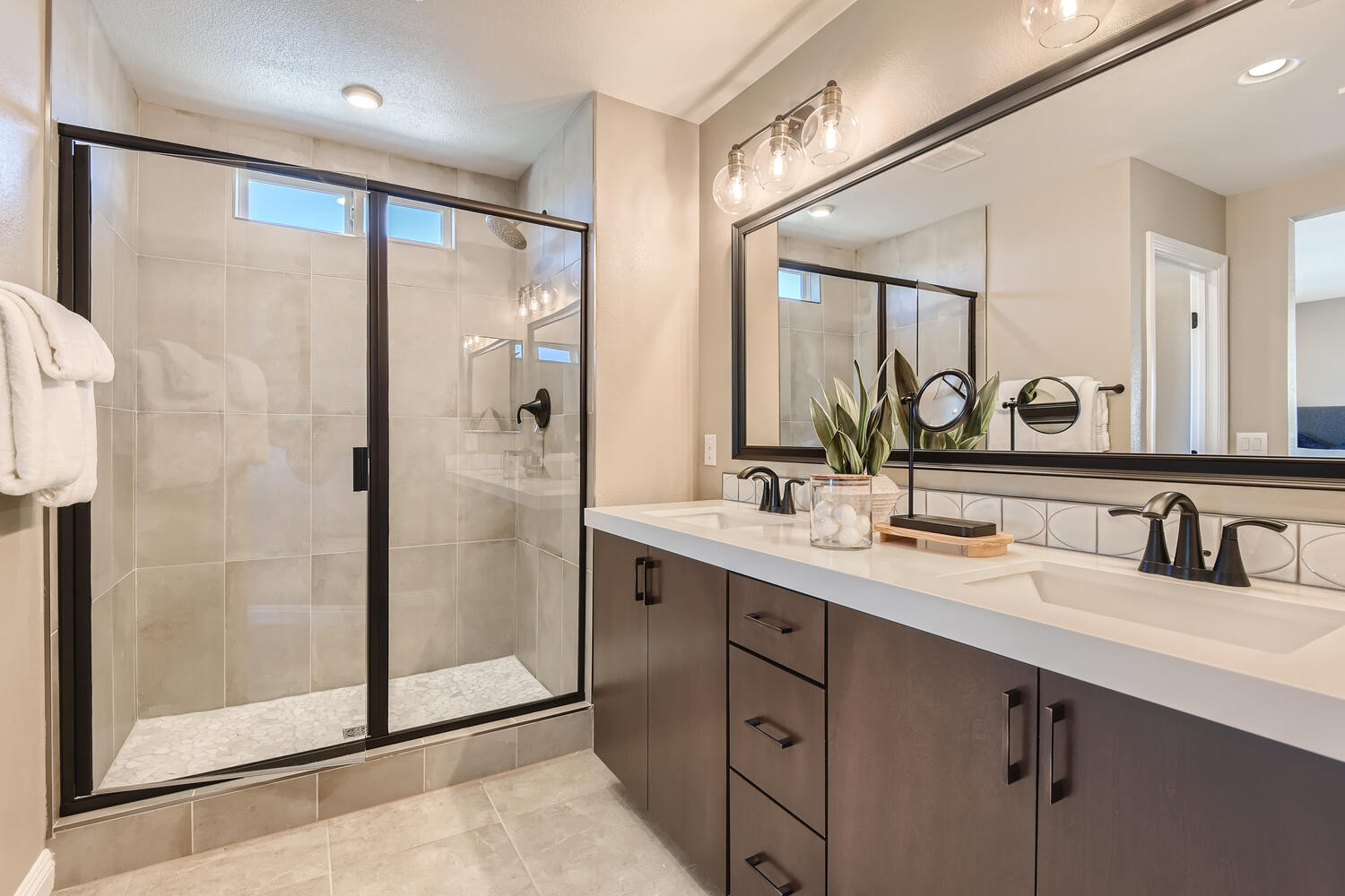 A bathroom with a glass shower.