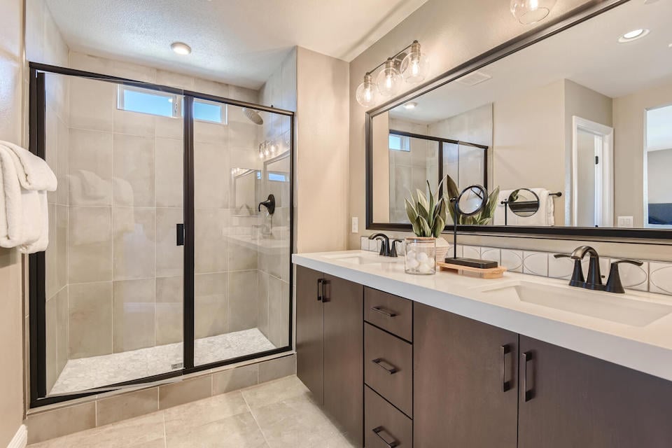 A bathroom with a glass shower.