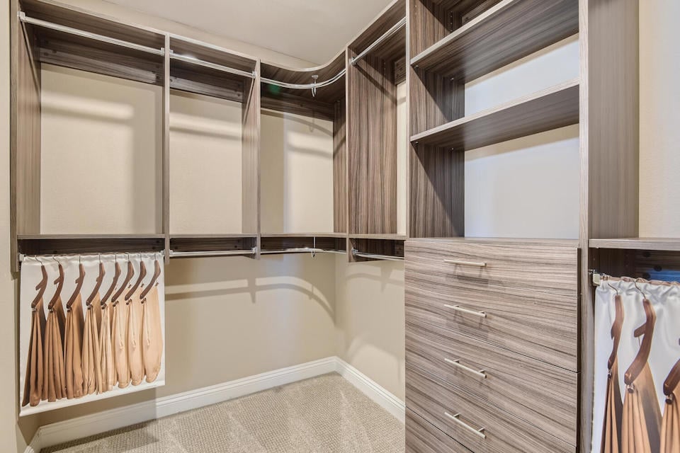 A room with a wood door and a window.