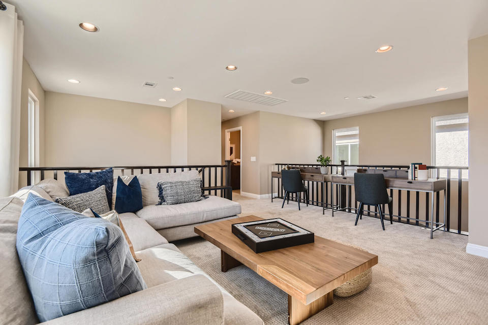 A large living room with a couch and a coffee table.