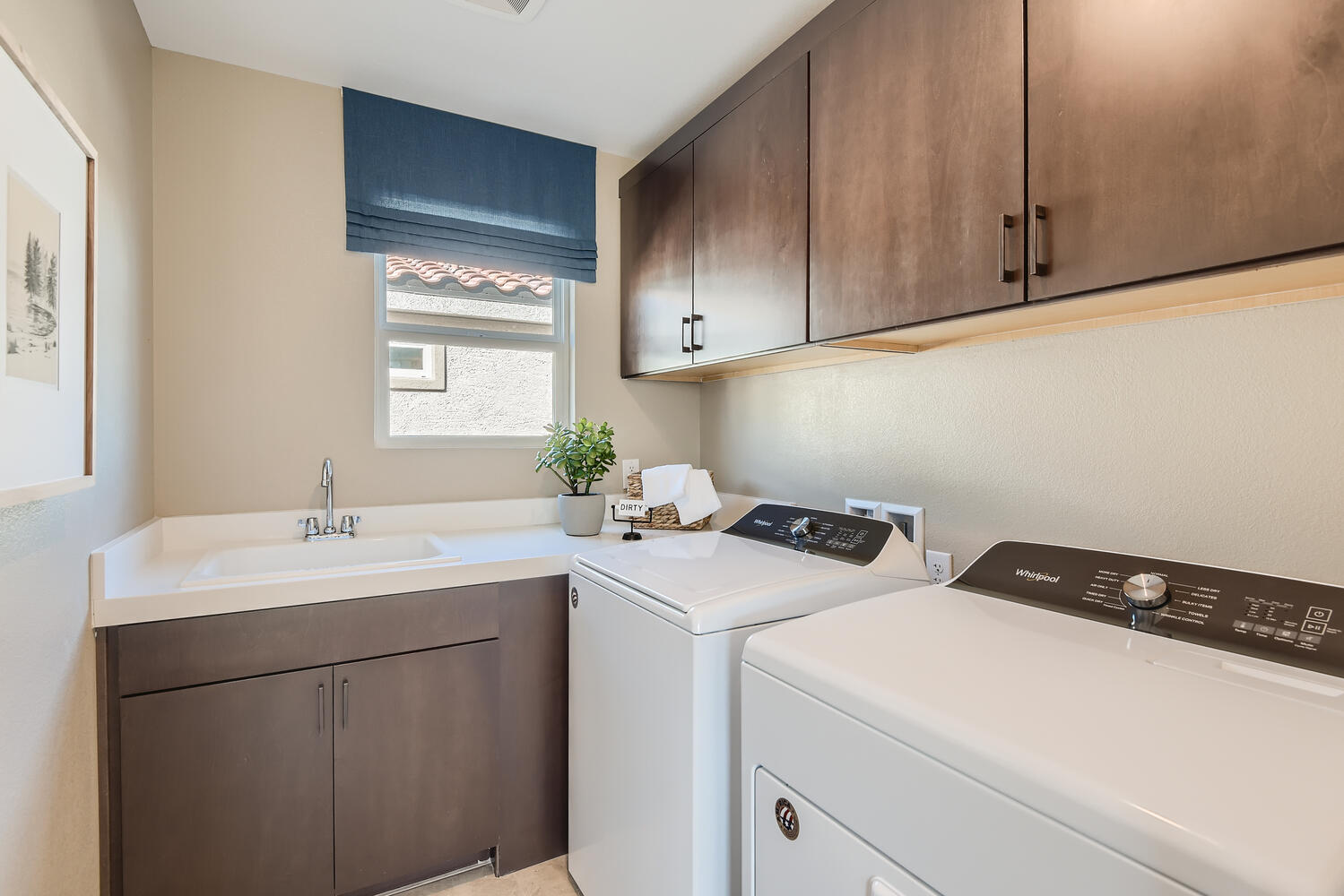 A kitchen with wooden cabinets.