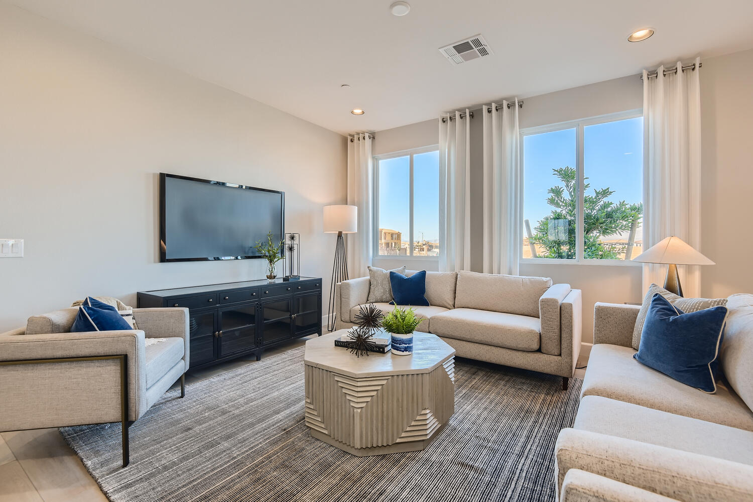 A living room with a tv and couches.