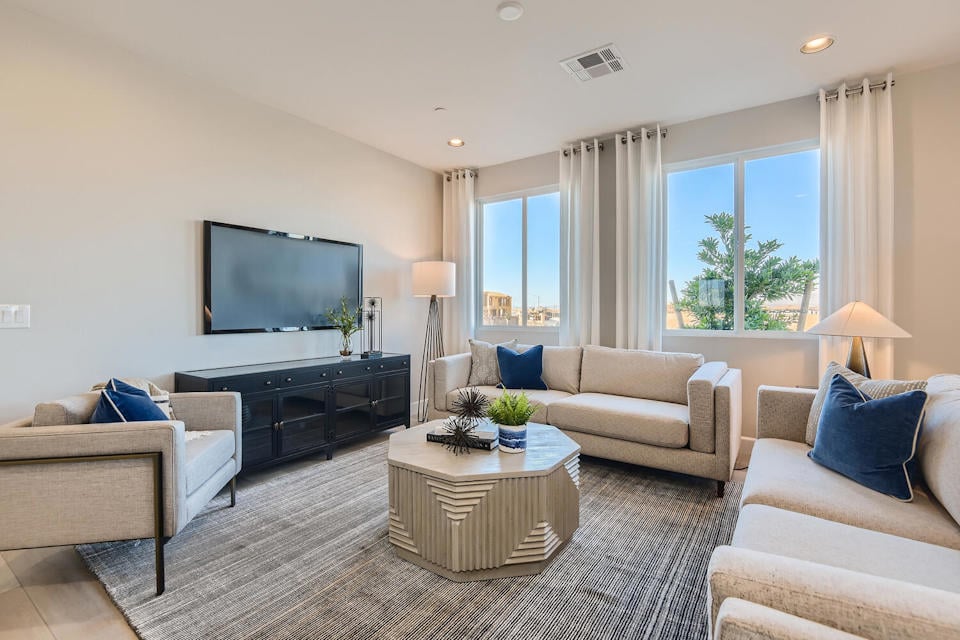 A living room with a tv and couches.