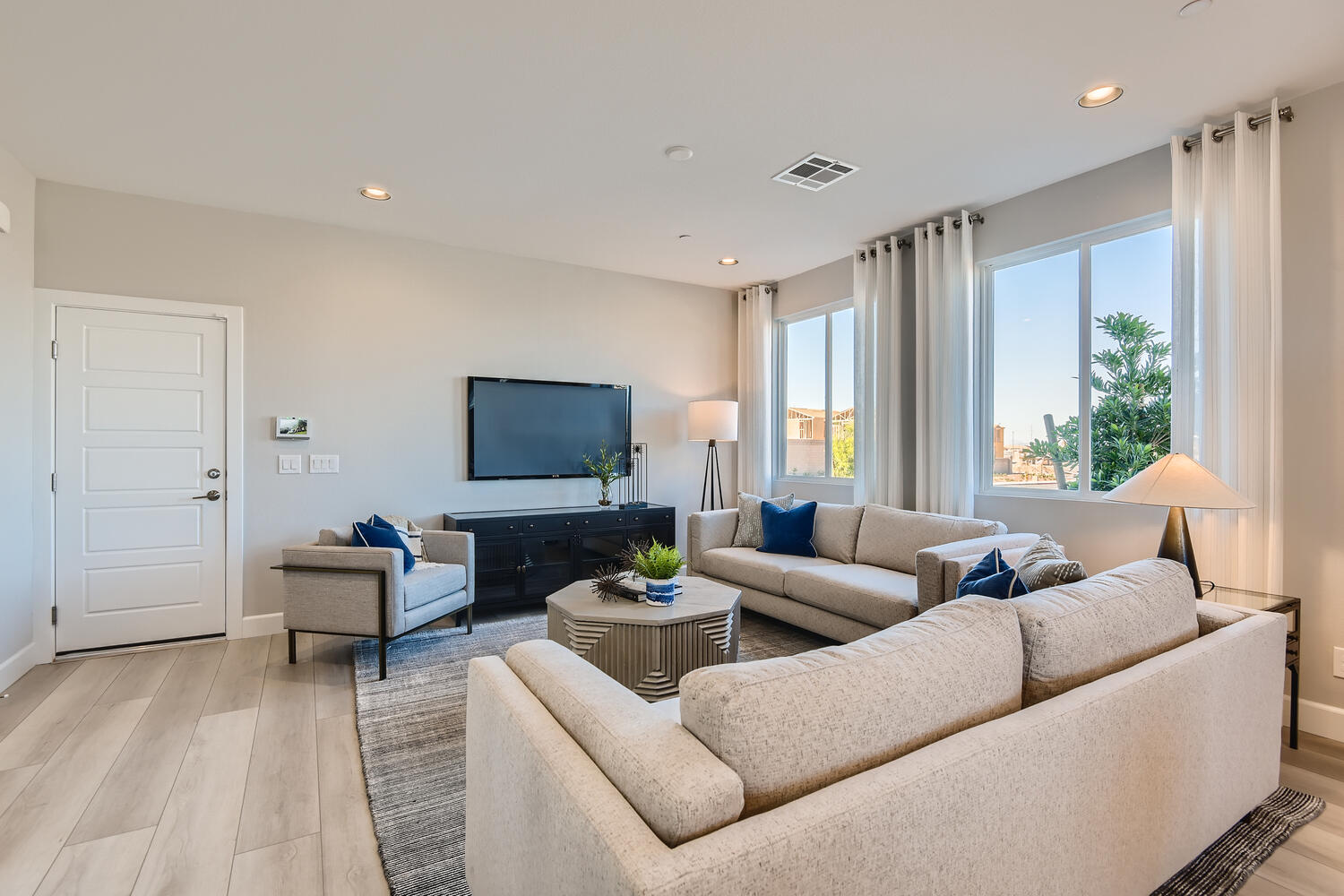 A living room with a large window.