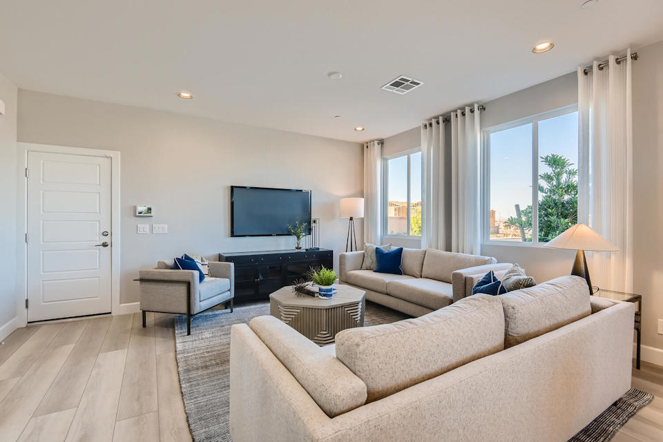 A living room with a large window.
