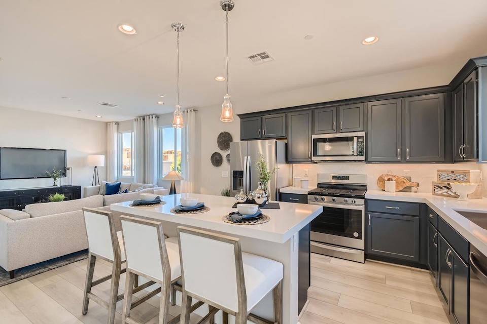 A kitchen with a dining table.