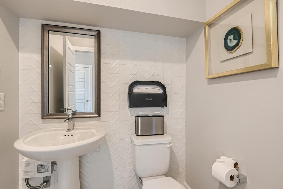 A bathroom with a sink and toilet.