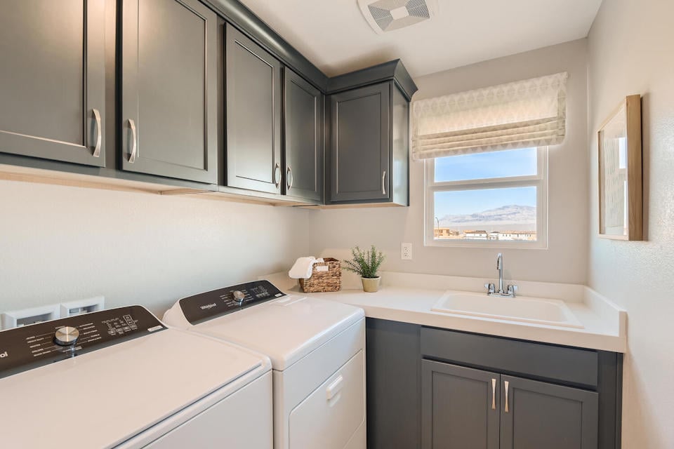 A kitchen with black cabinets.
