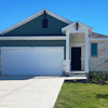 Ranch style house with white garage door