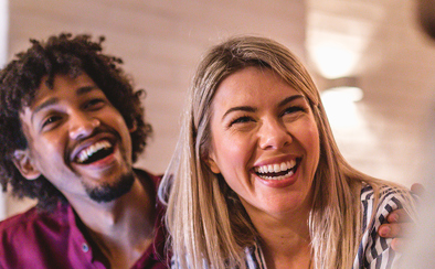 smiling couple applying for a new home loan