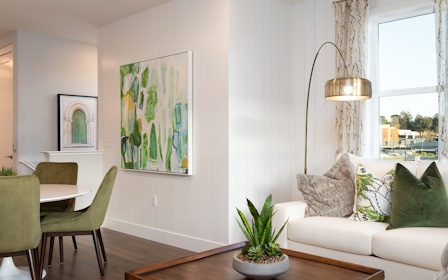 A living room with a couch and chairs.