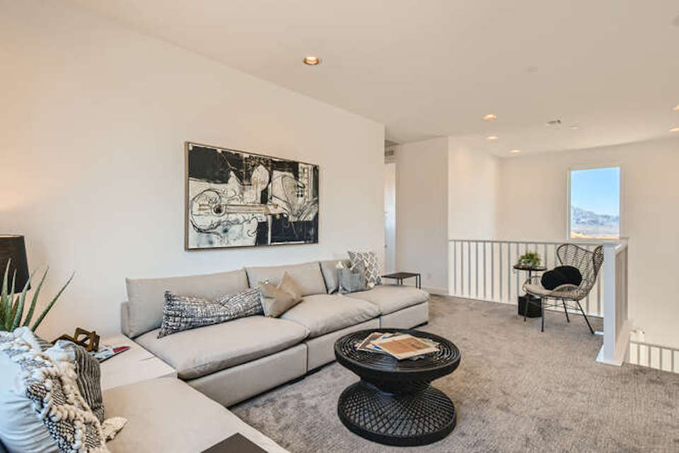 A living room with a couch and a coffee table.