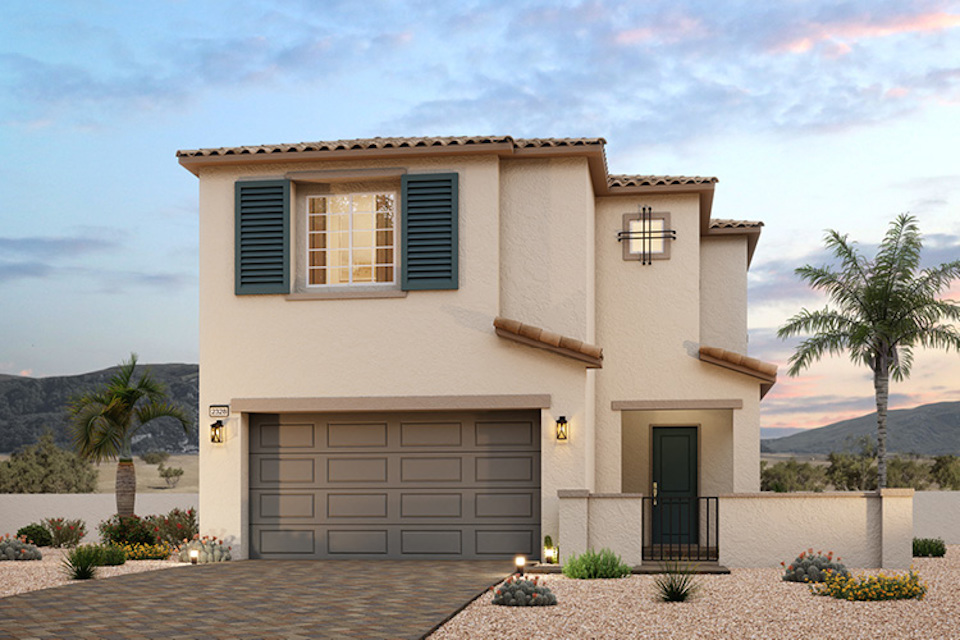 A house with a garage and a tree in the front.