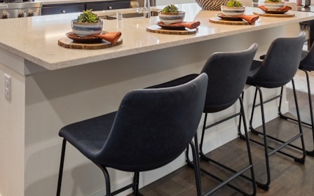 A table with chairs around it.