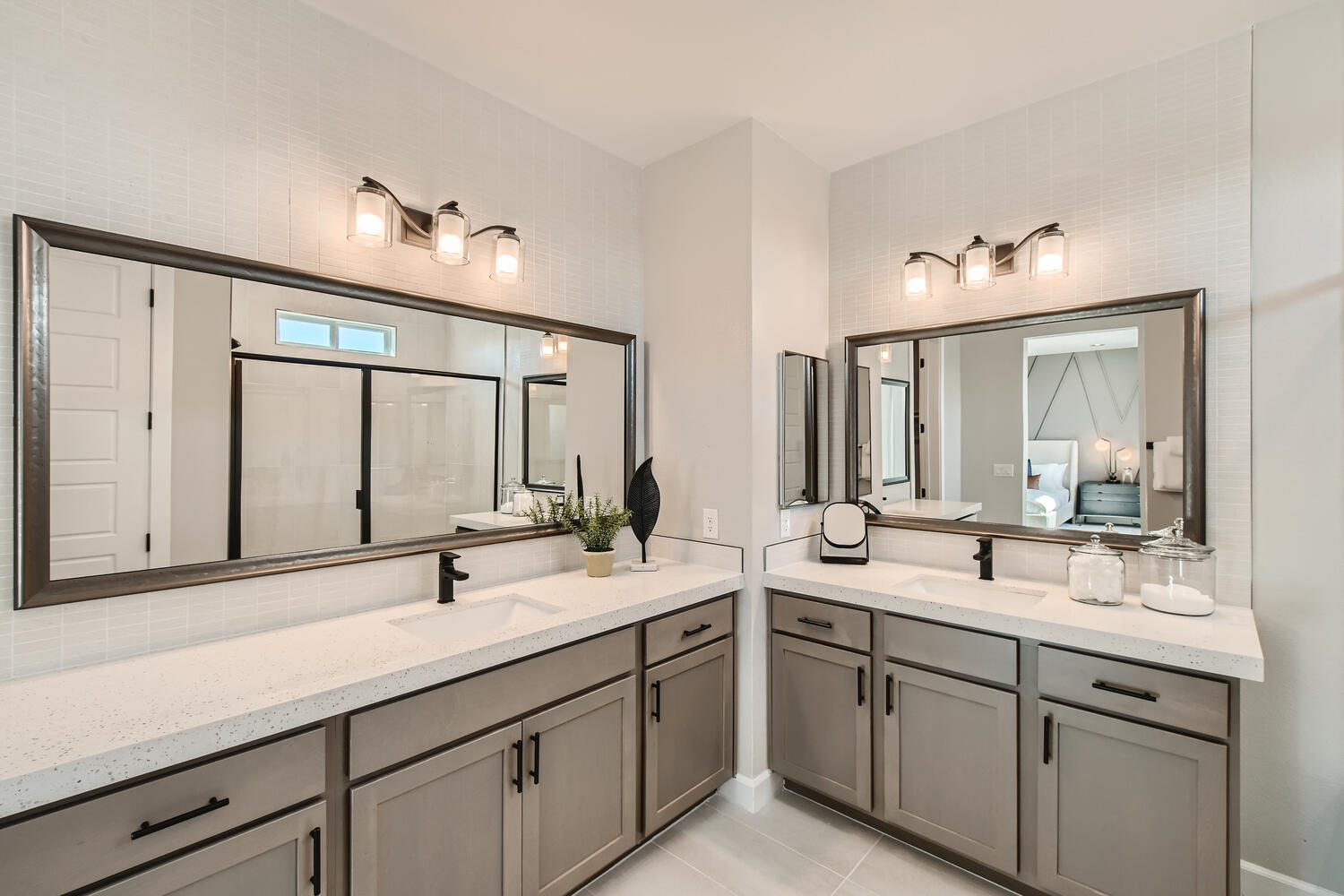 A bathroom with a large mirror.