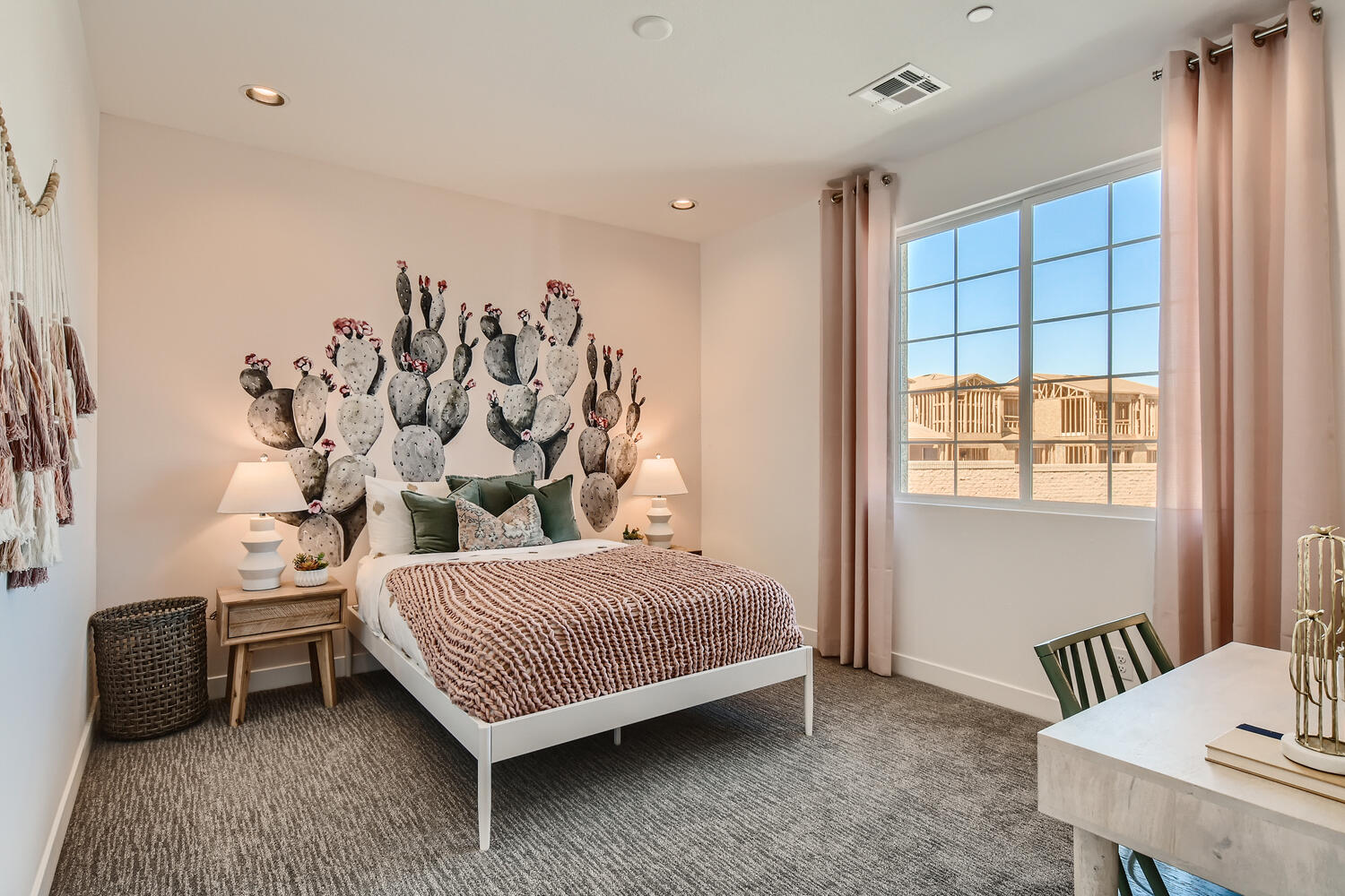 A bedroom with a bed and a window.