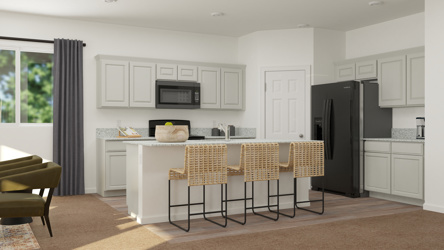 A kitchen with white cabinets.