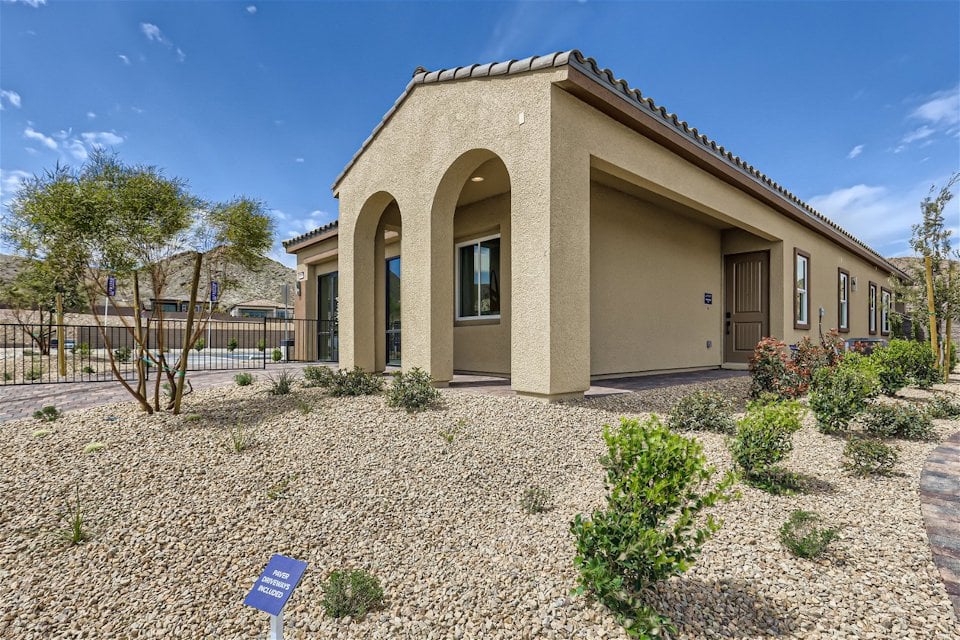 A building with a large front yard.