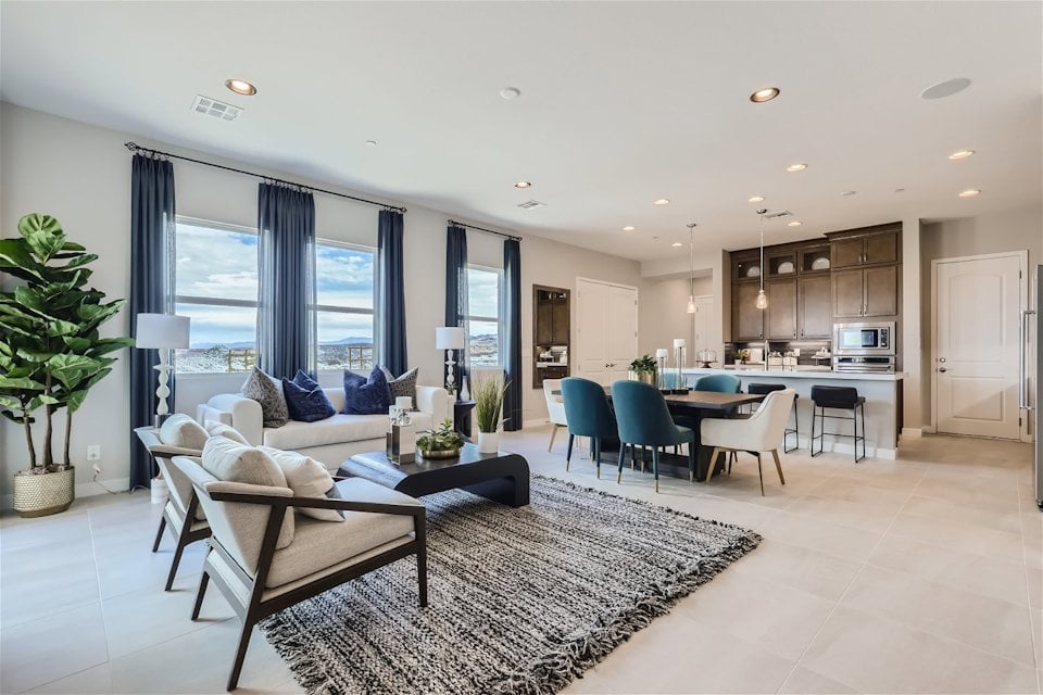 A large living room with a large window.