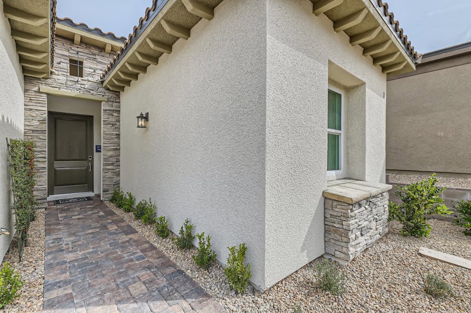 A stone building with a stone patio.