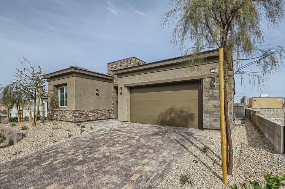 A building with a dirt yard.