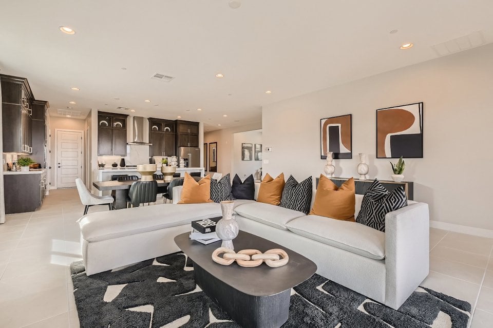 A living room with a couch and a table.