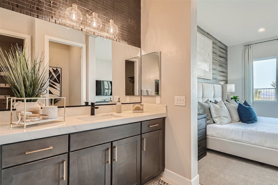 A bathroom with a bed and a couch.