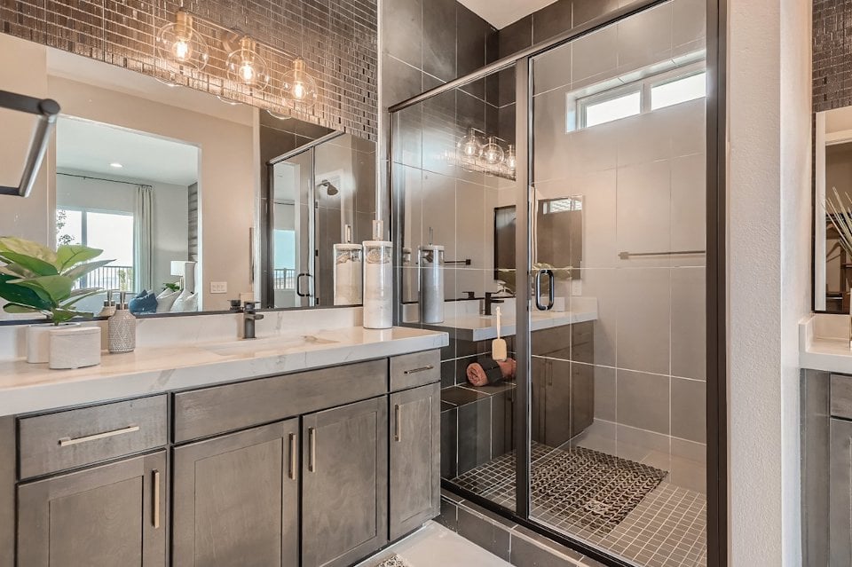 A bathroom with a glass shower.