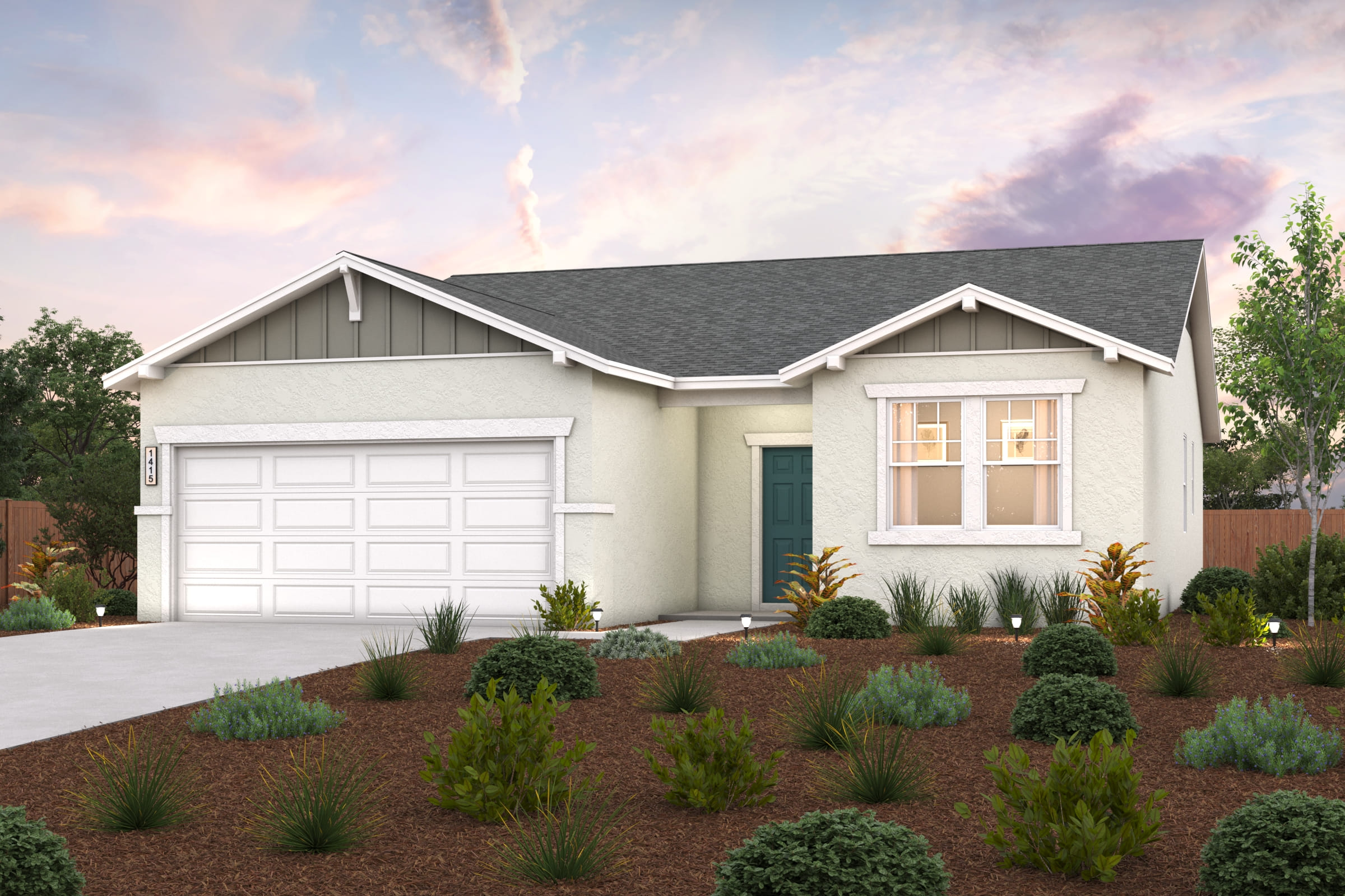 A house with a garage and bushes in front of it.