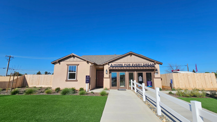 A building with a white fence.