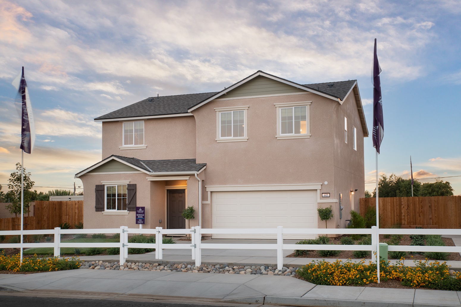 A house with a white picket fence.