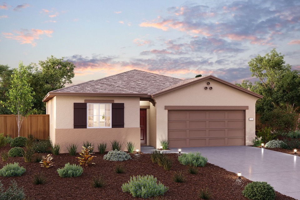 A house with a driveway and a pond in the front.