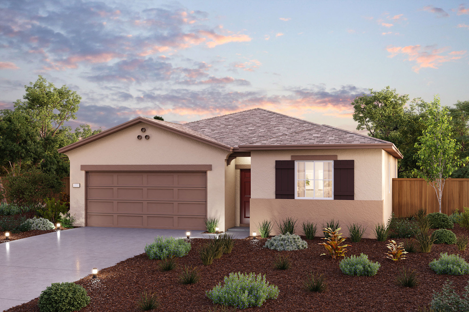 A house with a garage and a pond in the front.