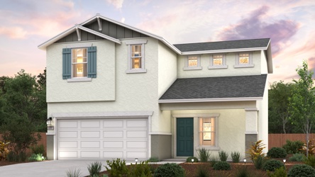 A white house with a garage.