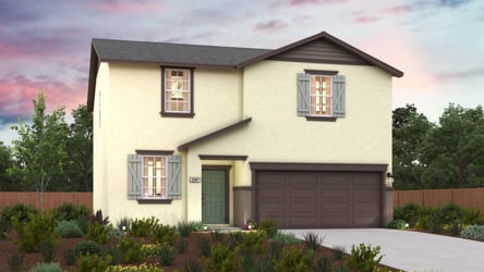 A house with a garage and a fence around it.