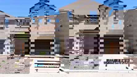 A building with a sign in front.