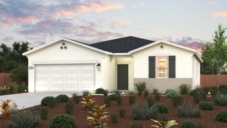 A house with bushes in front of it.