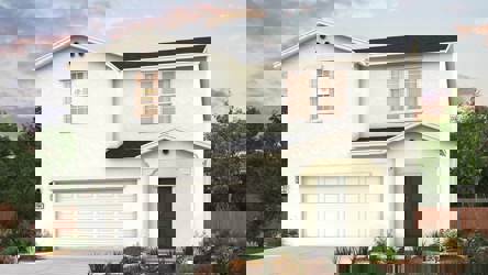 A white house with a garage.