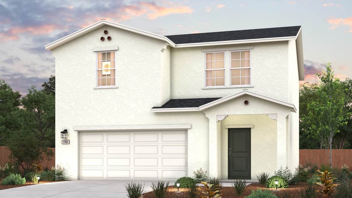 A white house with a garage.